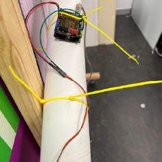 Arduino Uno secured onto carboard tube with zipties for the ball dispensing mechanism