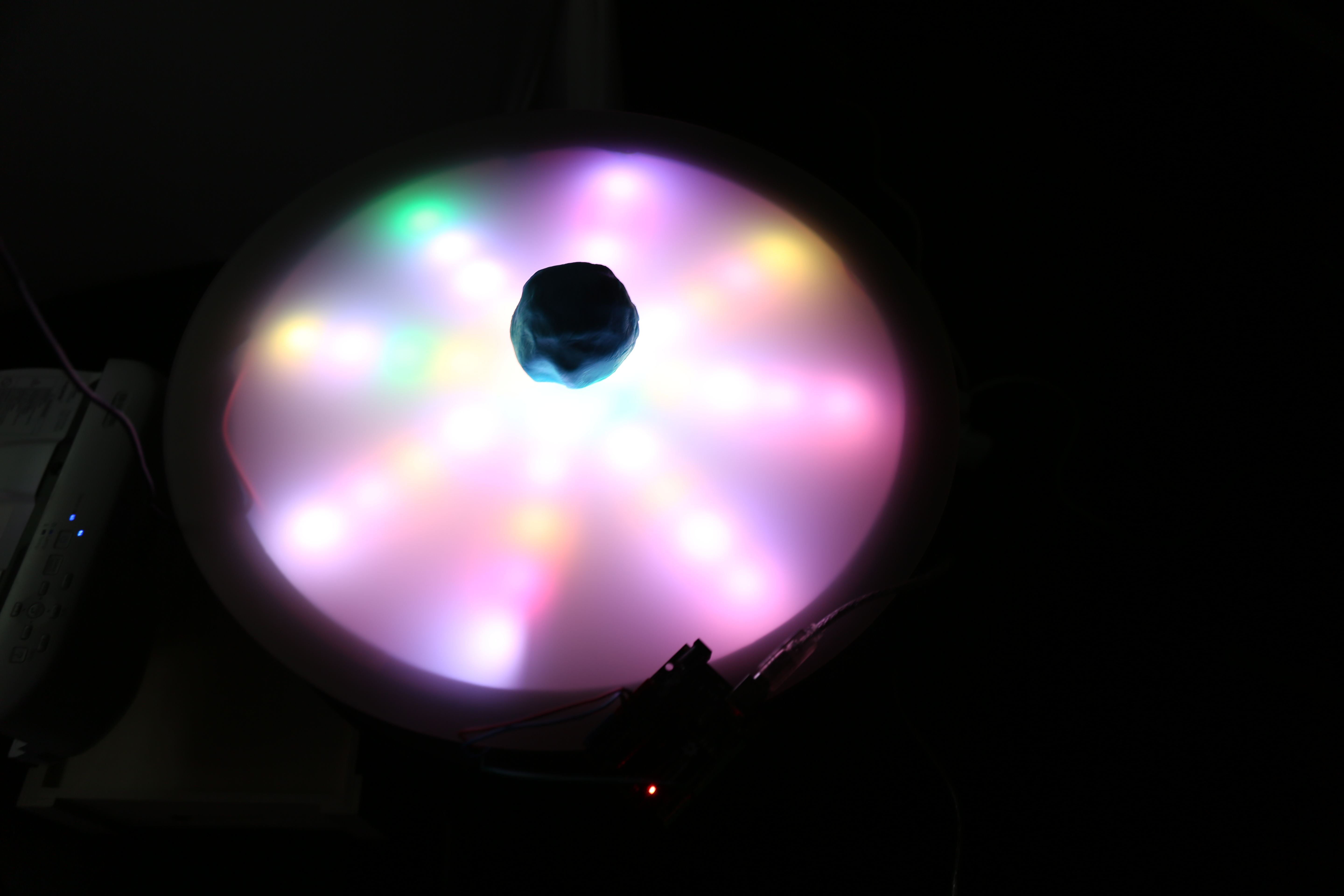 NeoPixel LEDs of the Pedestal turned on, in its final stage of light animations. This occurs within the user journey when the Unity scene is displayed on the Collaborative Space projection with the Mould placed in the centre.